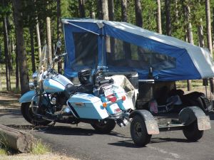 Motorbike and tent trailer at Madison Campground