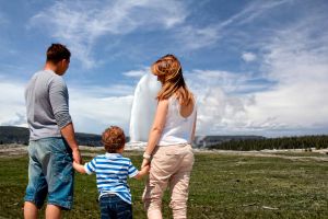 Family in front of geyser