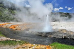 Geyser by River Erupting