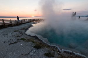 Photographing the sunrise at West Thumb Geyser Basin