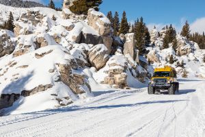 Snowcoach riding through the Hoodoos