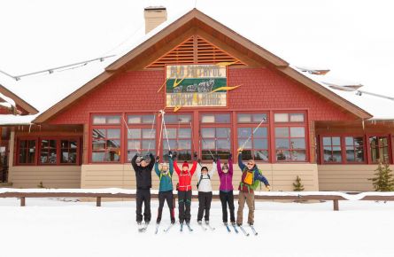 Skier group photo in front of Snow Lodge