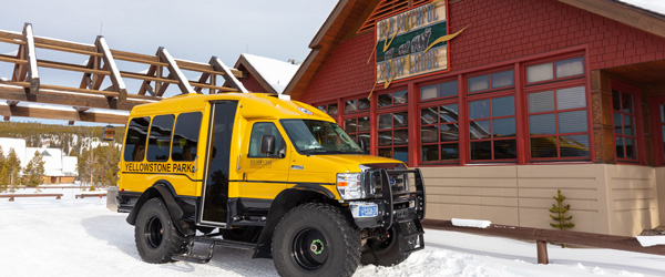 Snowcoach in front of Snow Lodge